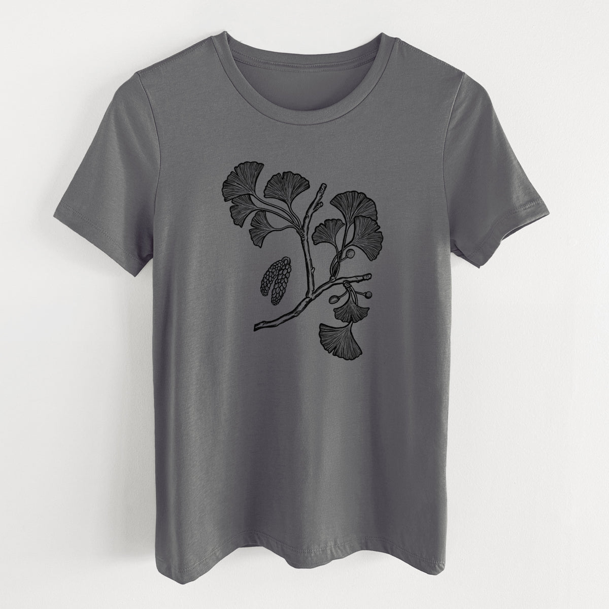Asphalt women's relaxed fit cotton t-shirt laid flat, printed with a black ink illustration of a ginkgo branch with fan-shaped leaves.
