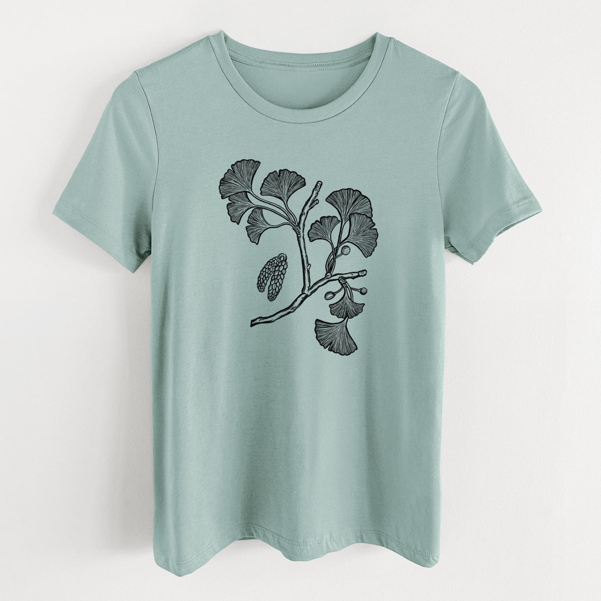 Dusty blue women's relaxed fit cotton t-shirt laid flat, printed with a black ink illustration of a ginkgo branch with fan-shaped leaves.