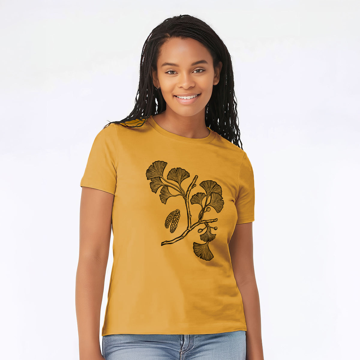 Woman wearing a mustard yellow women's relaxed fit cotton t-shirt printed with a black ink illustration of a ginkgo branch with fan-shaped leaves.
