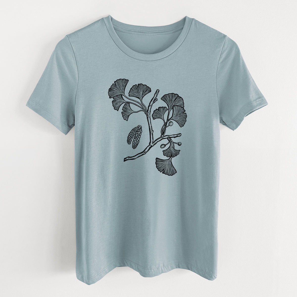 Vintage denim women's relaxed fit cotton t-shirt laid flat, printed with a black ink illustration of a ginkgo branch with fan-shaped leaves.