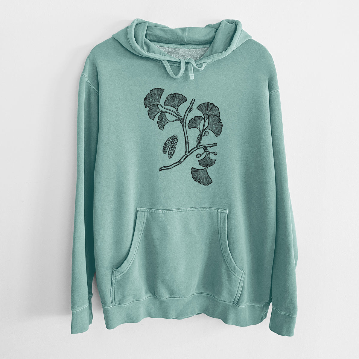 Mint green pigment dyed hoodie laid flat, printed with a black ink illustration of a ginkgo branch with fan-shaped leaves.