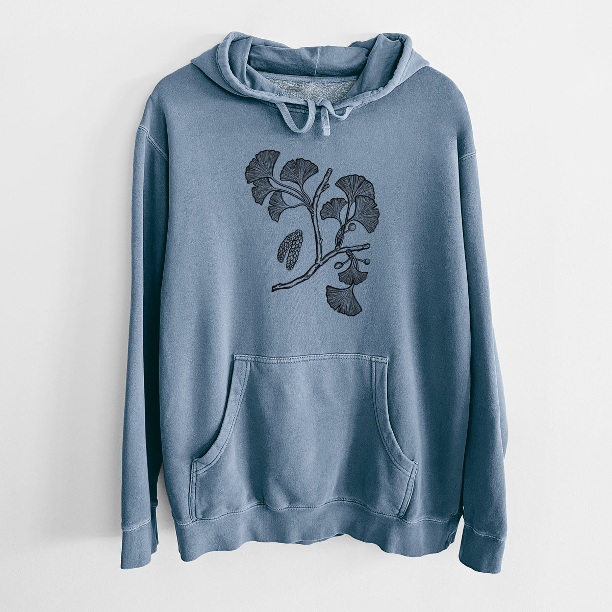 Slate blue pigment dyed hoodie laid flat, printed with a black ink illustration of a ginkgo branch with fan-shaped leaves.