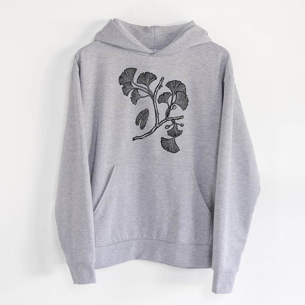 Ginkgo Biloba - Ginkgo Tree Stem with Leaves - Statement Midweight Hoodie in Heather Grey, hanging on a white wall, with a front kangaroo pocket and no drawcords.
