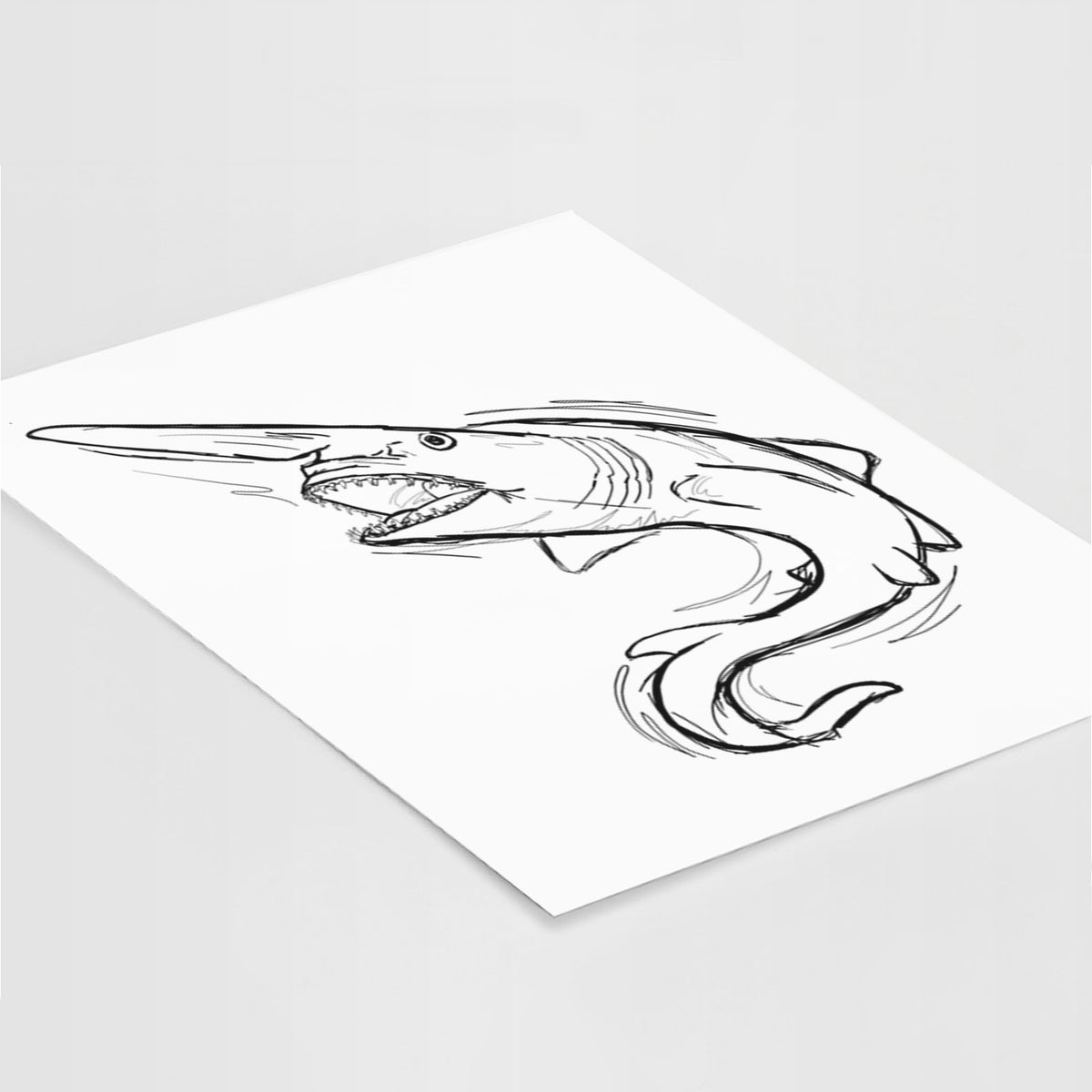 Art print of a black ink illustration of a goblin shark with its long snout, swimming in a curve, lying at an angle on a white surface.