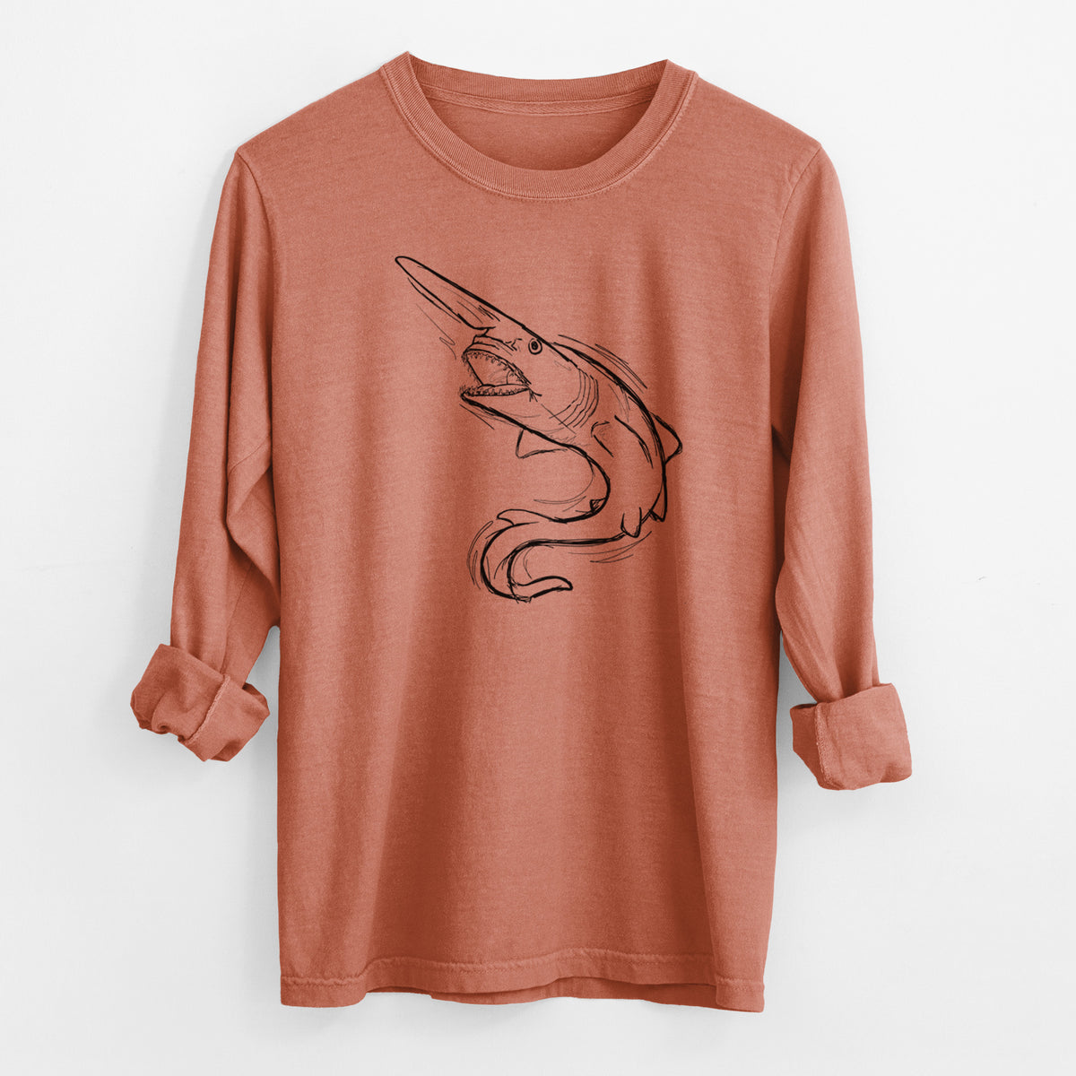 Yam burnt orange Comfort Colors long sleeve shirt laid flat with the cuffs rolled, printed with a black ink illustration of a goblin shark with its long snout, swimming in a curve.