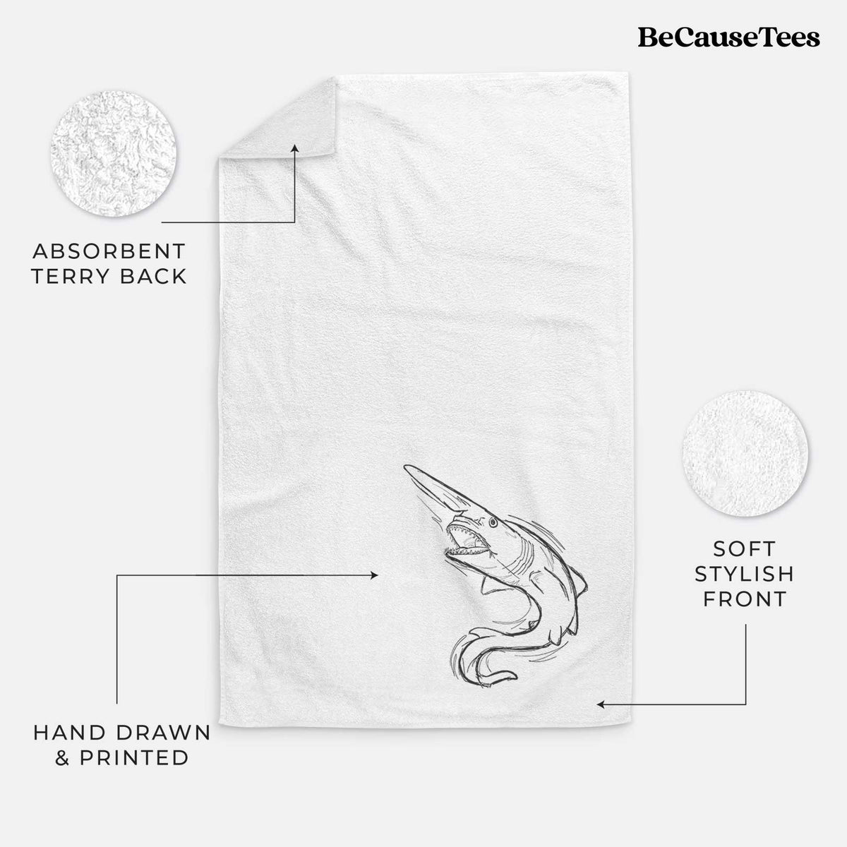 White hand towel printed with a black ink illustration of a goblin shark with its long snout, swimming in a curve.