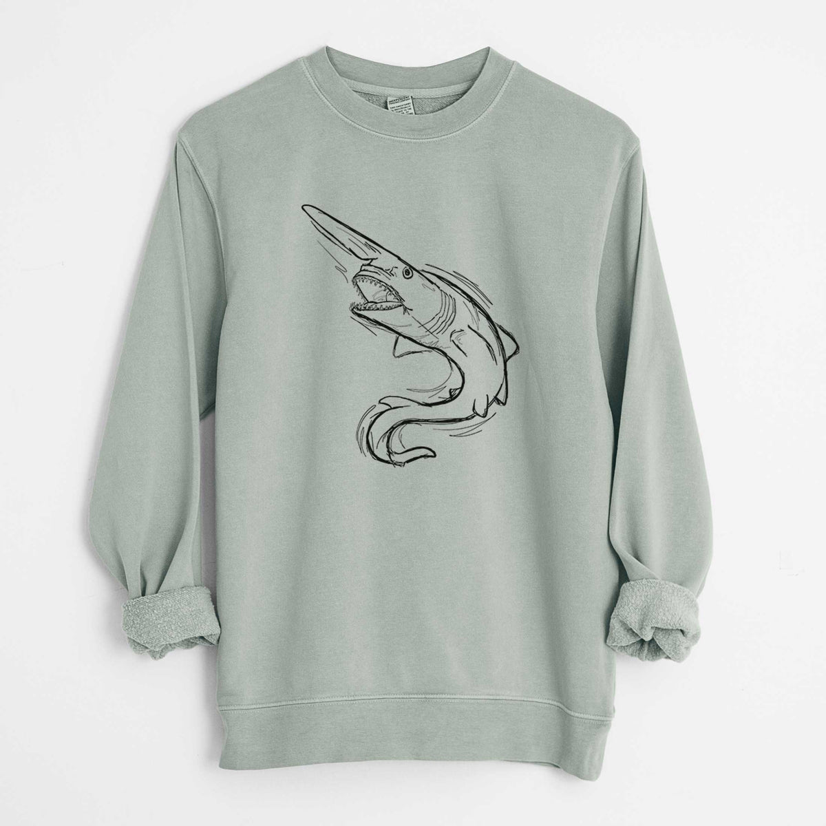 Sage green pigment dyed crewneck sweatshirt laid flat with the sleeves rolled, printed with a black ink illustration of a goblin shark with its long snout, swimming in a curve.