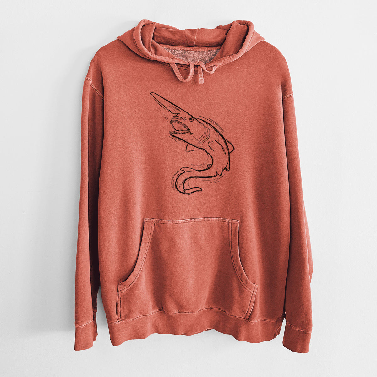 Amber orange pigment dyed hoodie laid flat, printed with a black ink illustration of a goblin shark with its long snout, swimming in a curve.