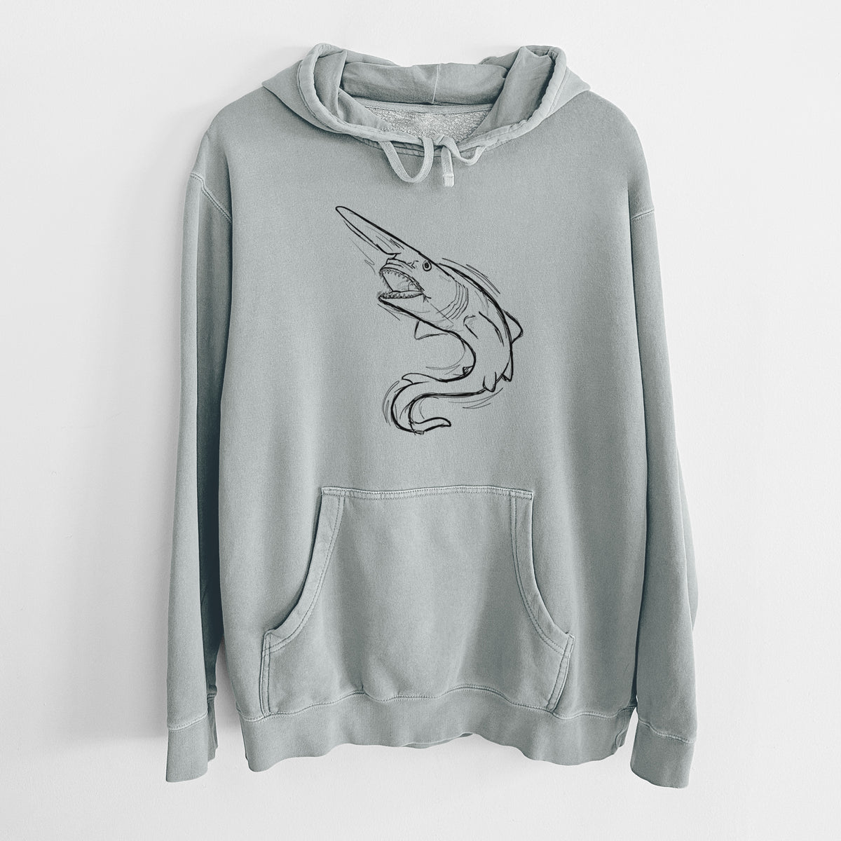 Sage green pigment dyed hoodie laid flat, printed with a black ink illustration of a goblin shark with its long snout, swimming in a curve.