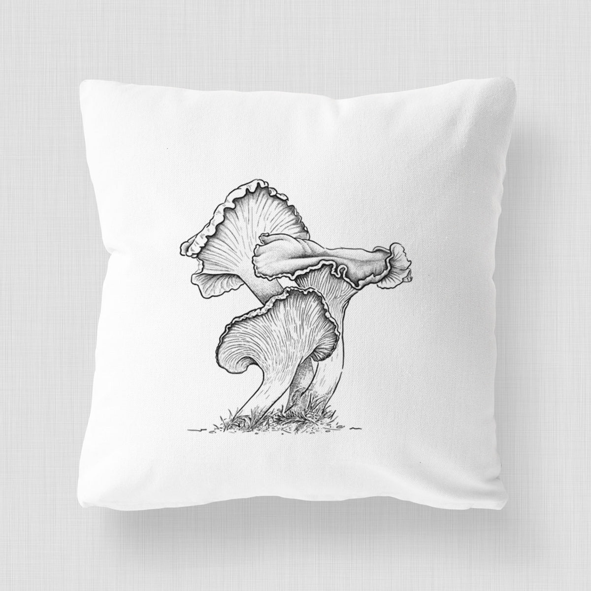 White pillow cover printed with a detailed black ink illustration of golden chanterelle mushrooms.