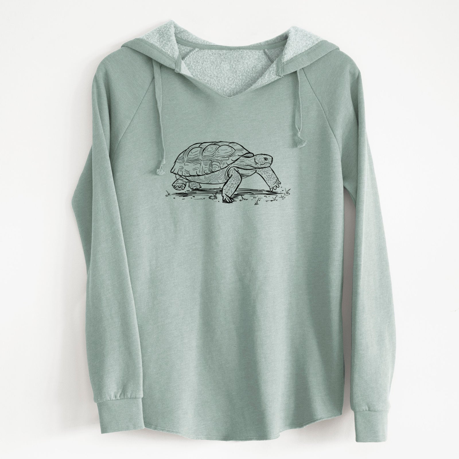 Sage green women's Cali Wave hooded sweatshirt laid flat, printed with a detailed black ink illustration of a gopher tortoise walking.
