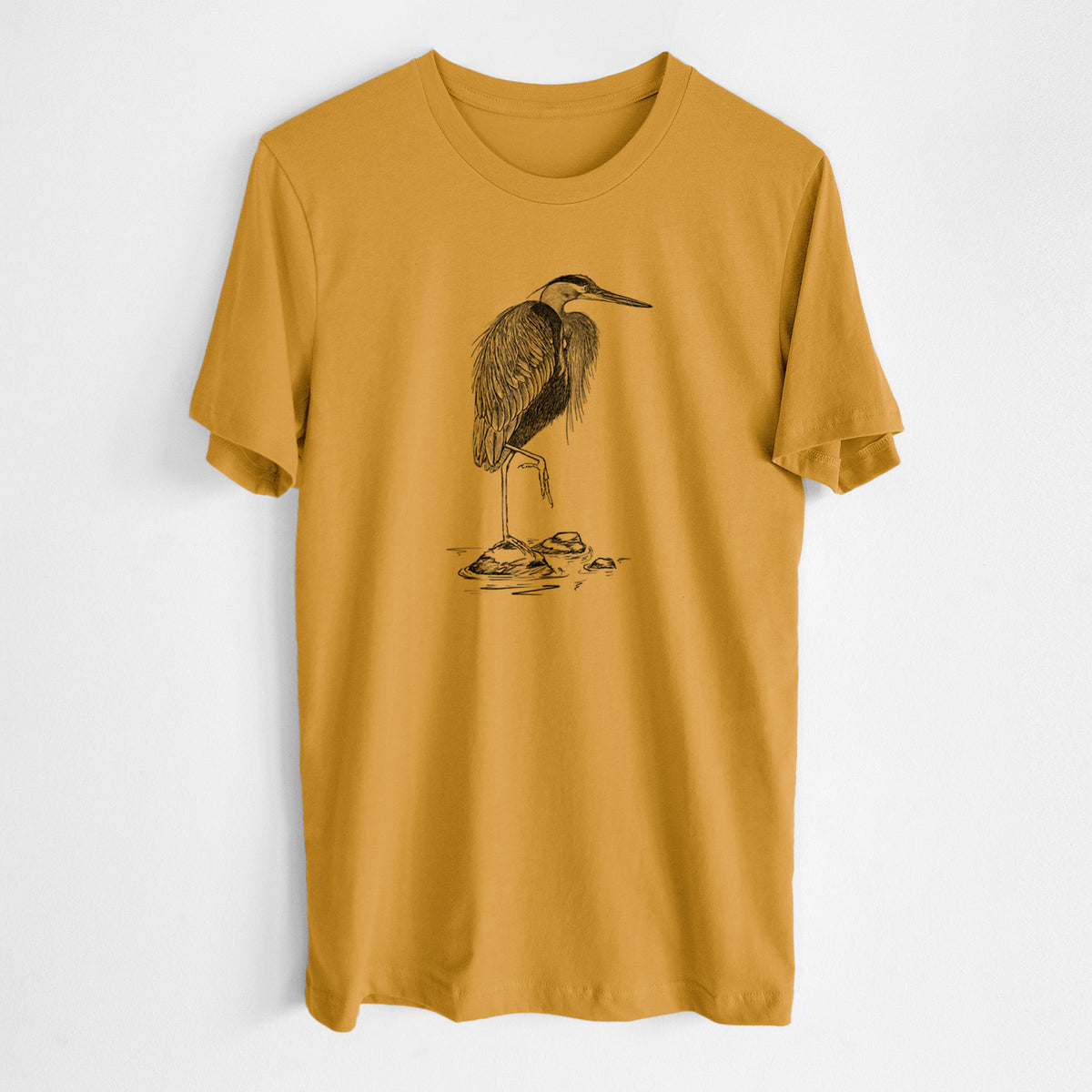 Honeycomb yellow lightweight cotton t-shirt laid flat, printed with a detailed black ink illustration of a great blue heron standing on rocks.