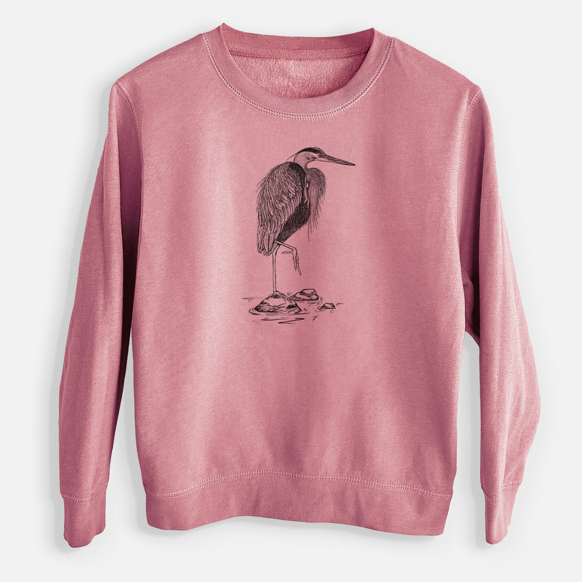 Mauve pink youth crewneck sweatshirt laid flat, printed with a detailed black ink illustration of a great blue heron standing on rocks.