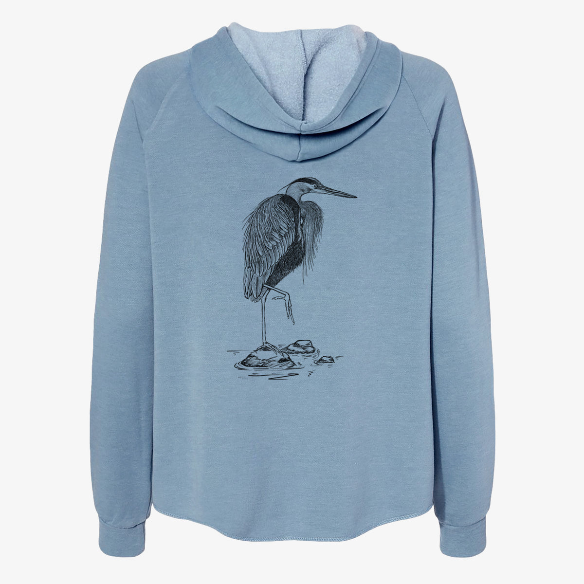 Misty blue women's Cali Wave zip-up sweatshirt laid flat, printed with a detailed black ink illustration of a great blue heron standing on rocks.