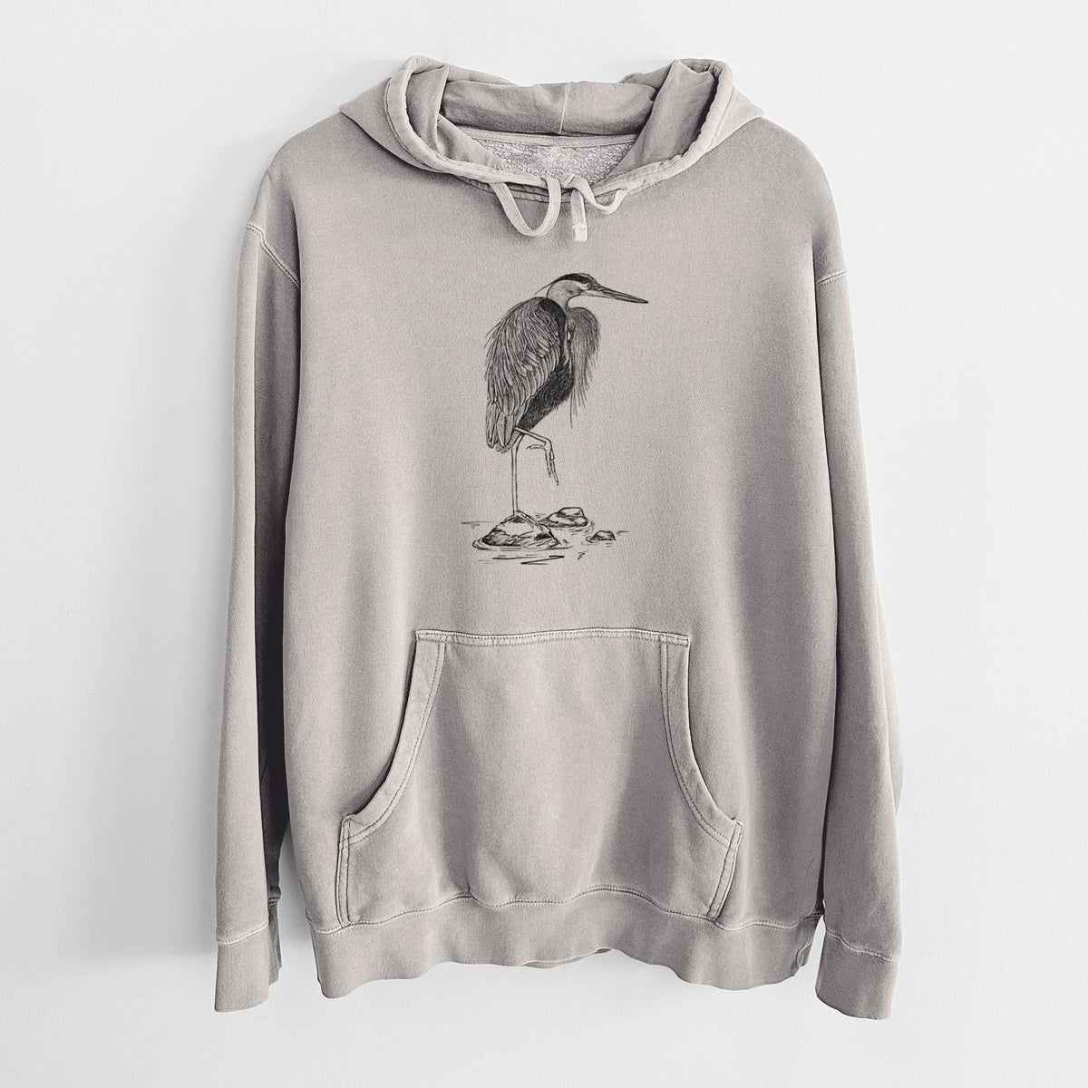 Cement grey pigment dyed hoodie laid flat, printed with a detailed black ink illustration of a great blue heron standing on rocks.