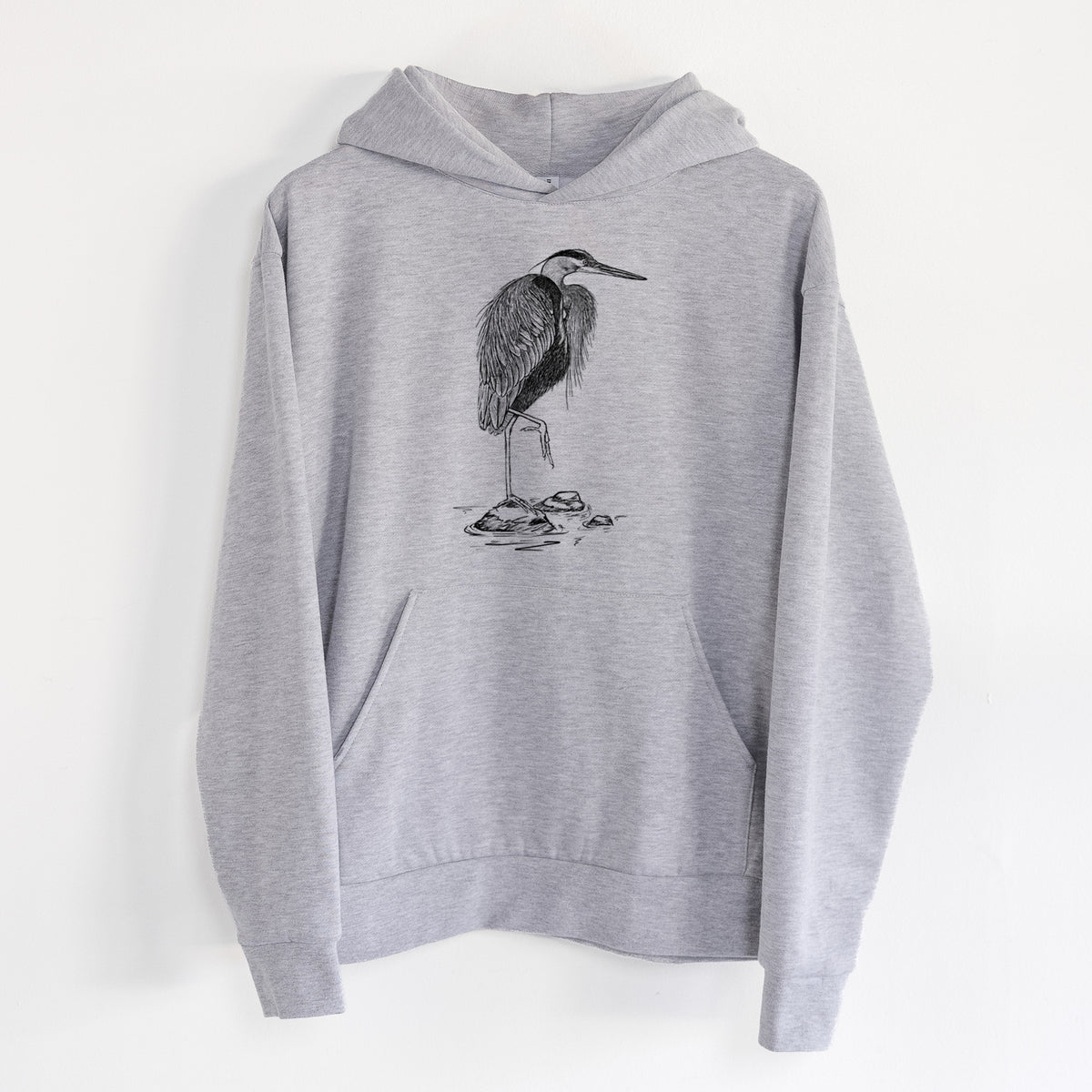 Ardea herodias - Great Blue Heron - Statement Midweight Hoodie in Heather Grey, hanging on a white wall, with a front kangaroo pocket and no drawcords.