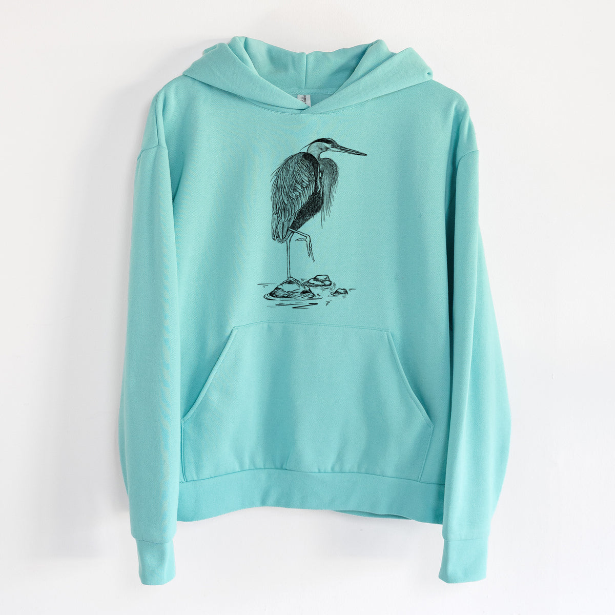 Ardea herodias - Great Blue Heron - Statement Midweight Hoodie in Seafoam, hanging on a white wall, with a front kangaroo pocket and no drawcords.