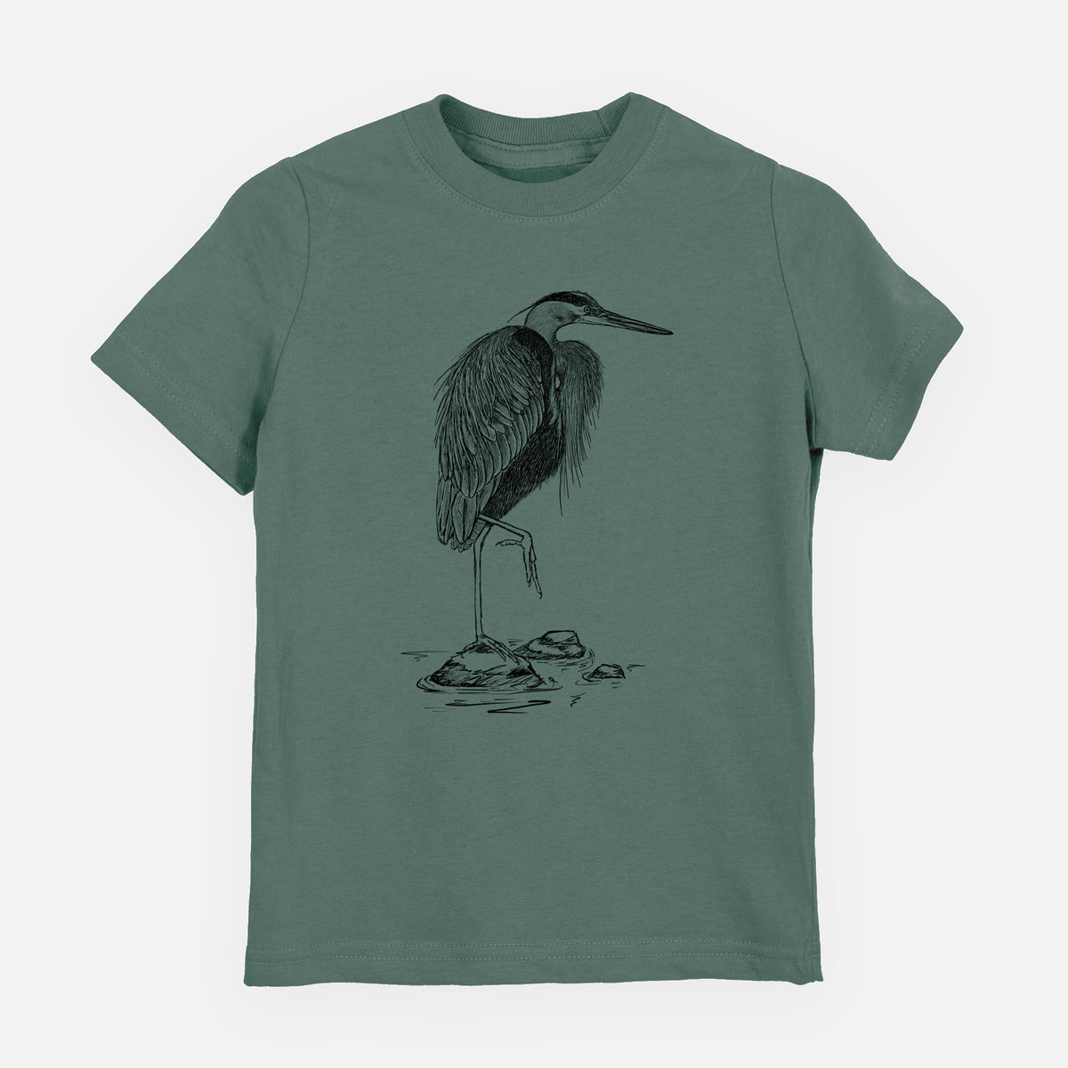 Basil green youth t-shirt laid flat, printed with a detailed black ink illustration of a great blue heron standing on rocks.