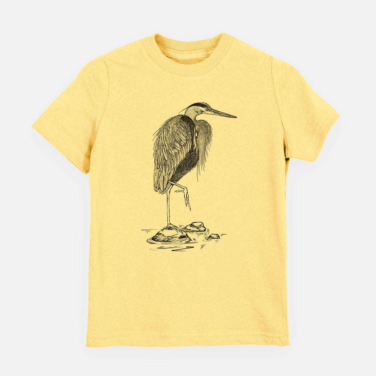 Butter yellow youth t-shirt laid flat, printed with a detailed black ink illustration of a great blue heron standing on rocks.