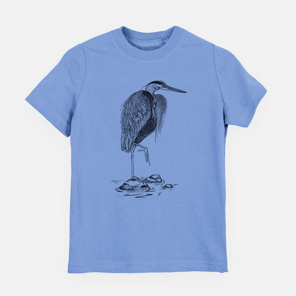 Carolina blue youth t-shirt laid flat, printed with a detailed black ink illustration of a great blue heron standing on rocks.