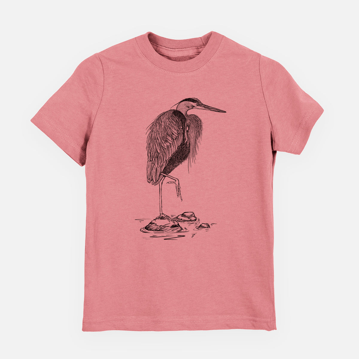 Mauve pink youth t-shirt laid flat, printed with a detailed black ink illustration of a great blue heron standing on rocks.