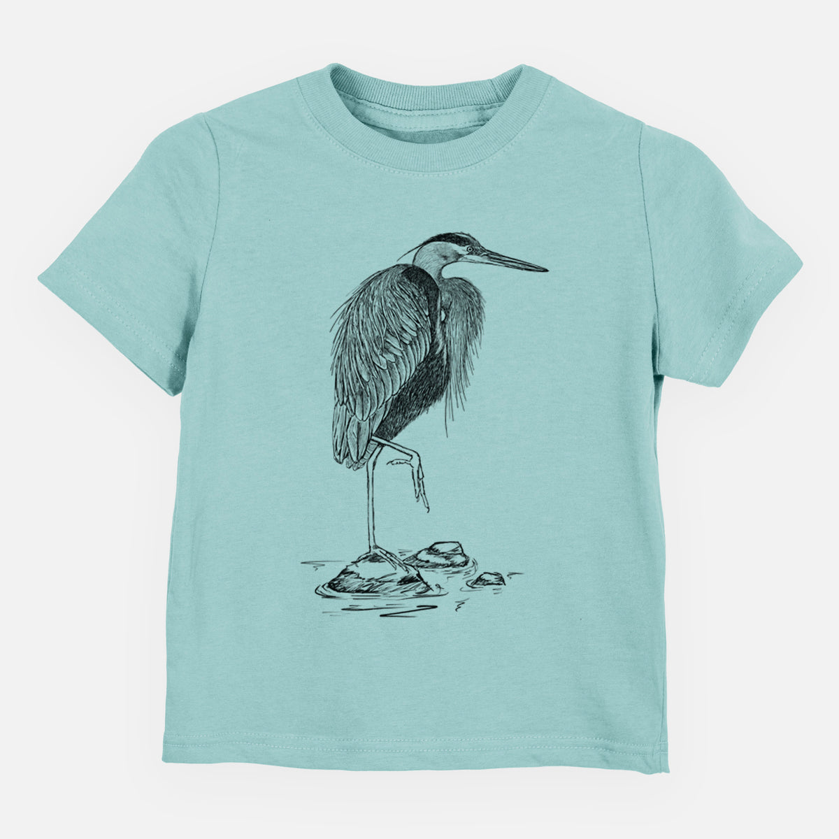 Saltwater toddler t-shirt laid flat, printed with a detailed black ink illustration of a great blue heron standing on rocks.
