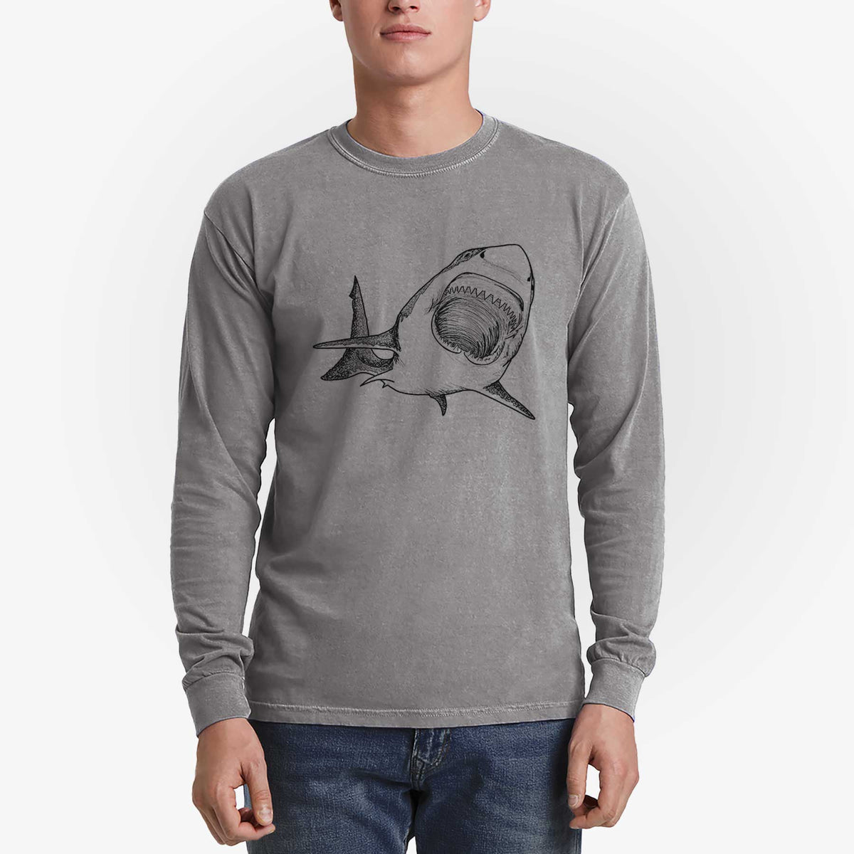 Man wearing a grey Comfort Colors long sleeve shirt printed with a black ink illustration of a great white shark swimming toward the viewer with its mouth open.