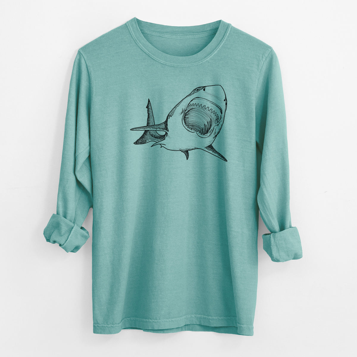 Reef green Comfort Colors long sleeve shirt laid flat with the cuffs rolled, printed with a black ink illustration of a great white shark swimming toward the viewer with its mouth open.