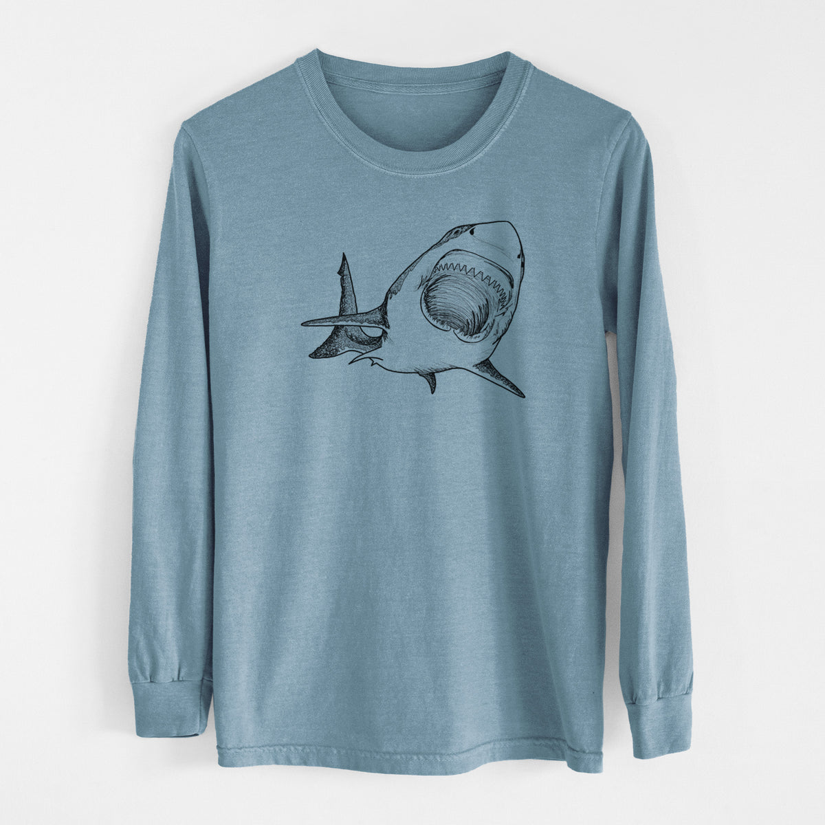 Steel blue Comfort Colors long sleeve shirt laid flat, printed with a black ink illustration of a great white shark swimming toward the viewer with its mouth open.