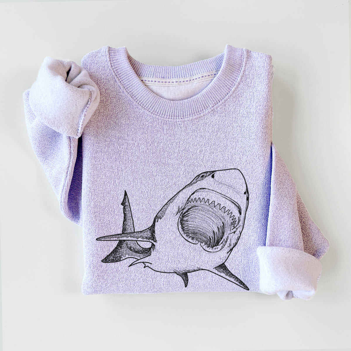 Ice purple knit sweatshirt printed with a black ink illustration of a great white shark swimming toward the viewer with its mouth open, styled flat.