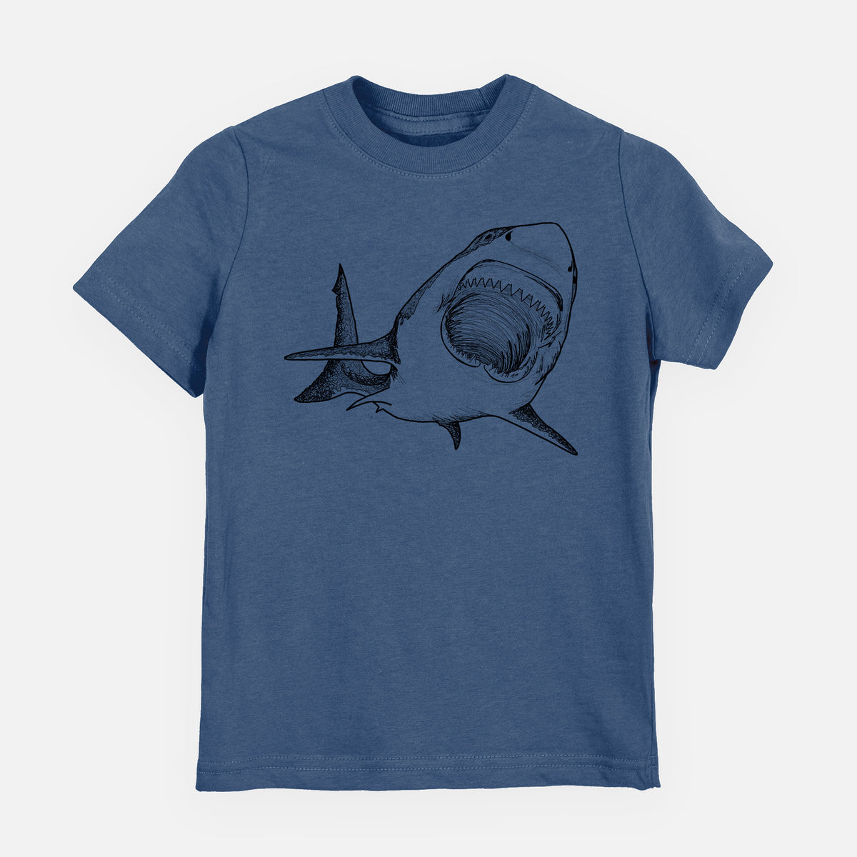 Indigo blue youth t-shirt laid flat, printed with a black ink illustration of a great white shark swimming toward the viewer with its mouth open.