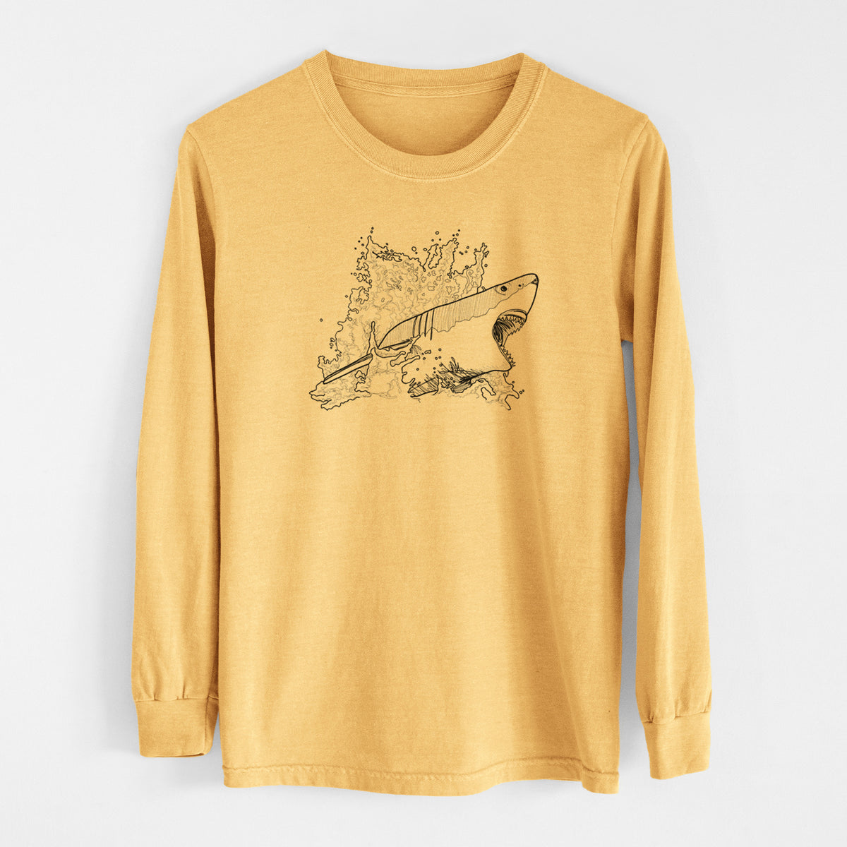 Golden wheat yellow Comfort Colors long sleeve shirt laid flat, printed with a black ink illustration of a great white shark breaking through a splash of water.
