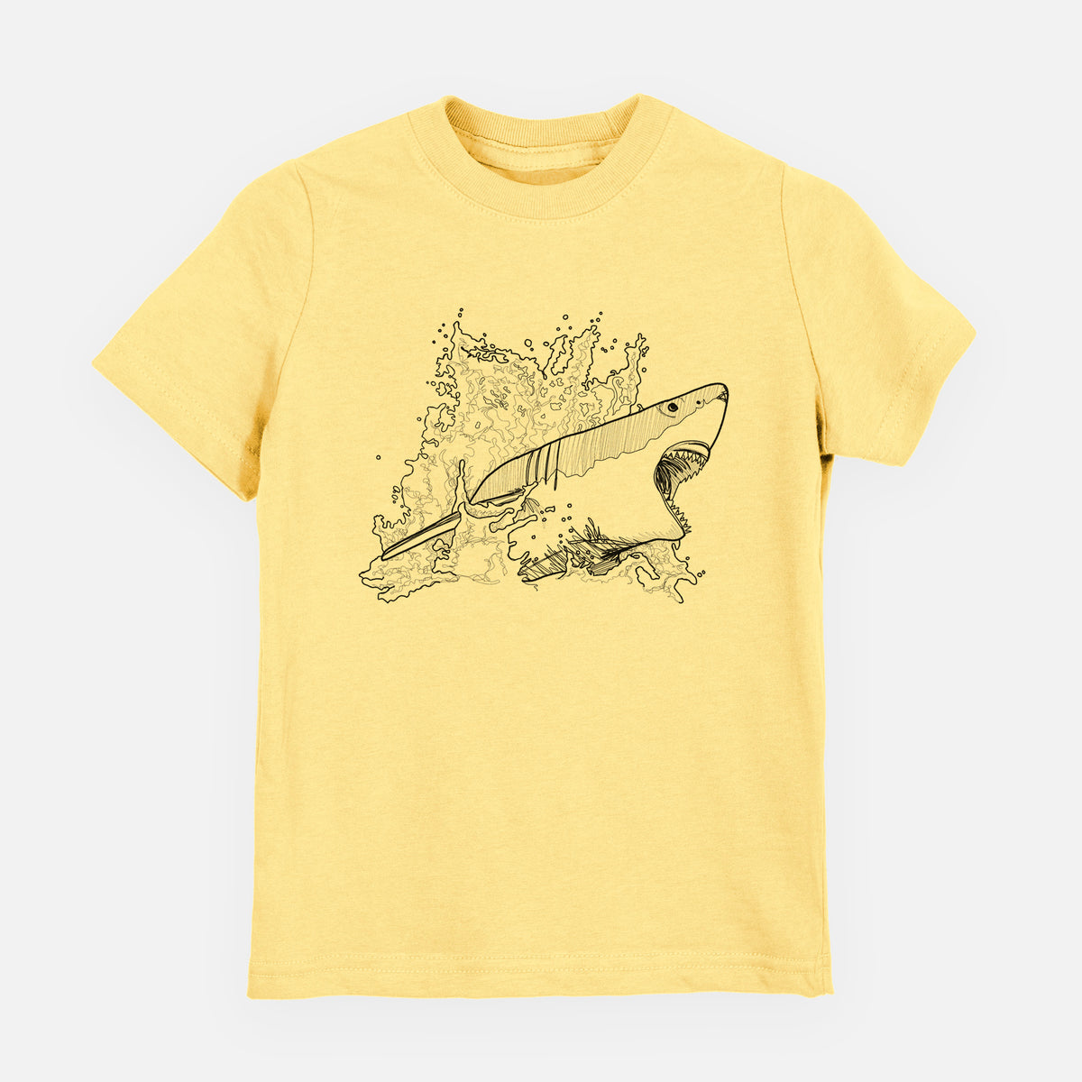 Butter yellow youth t-shirt laid flat, printed with a black ink illustration of a great white shark breaking through a splash of water.
