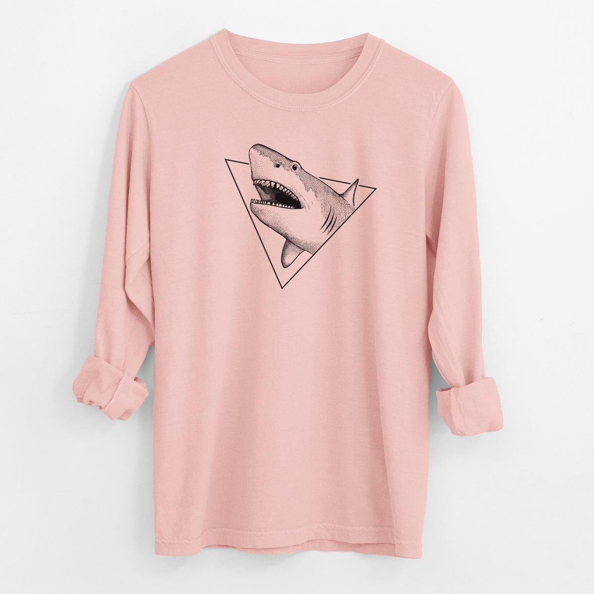 Peachy Comfort Colors long sleeve shirt laid flat with the cuffs rolled, printed with a black ink great white shark bursting out of a triangle outline with its mouth open.