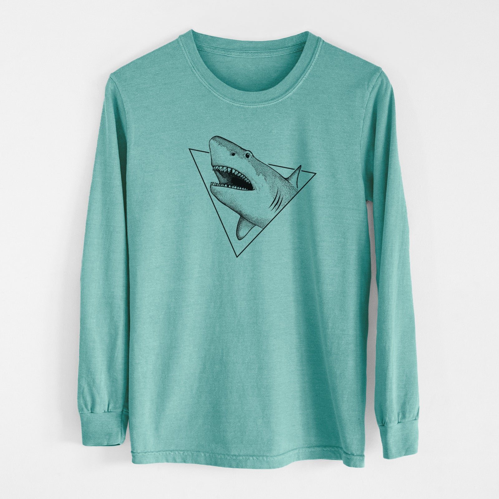 Reef green Comfort Colors long sleeve shirt laid flat, printed with a black ink great white shark bursting out of a triangle outline with its mouth open.