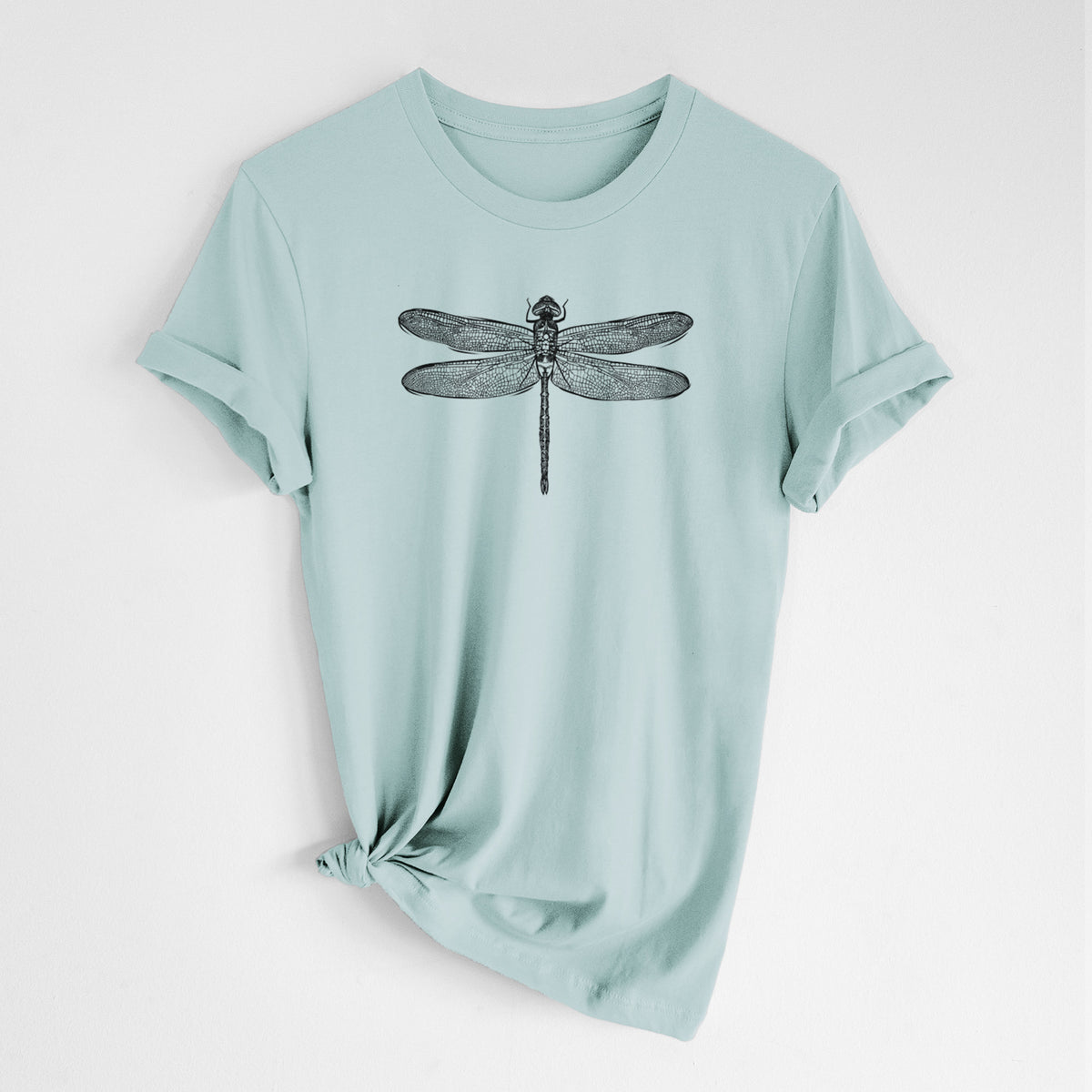Dusty blue lightweight cotton t-shirt laid flat with the sleeves rolled, printed with a detailed black ink illustration of a green darner dragonfly with its wings spread, seen from above.