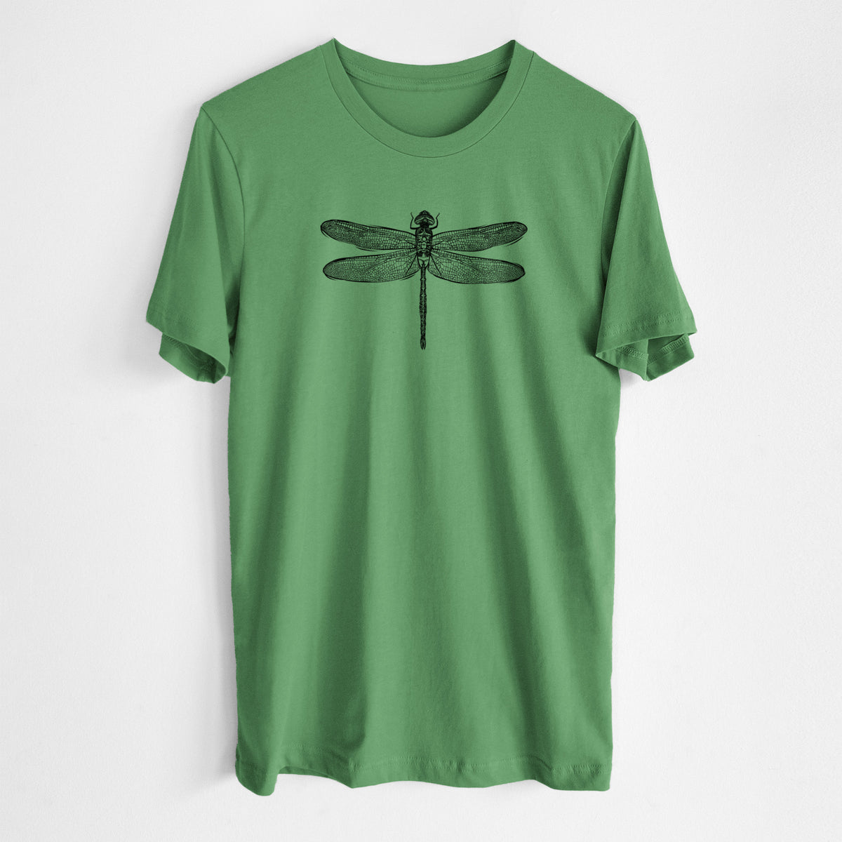 Leaf green lightweight cotton t-shirt laid flat, printed with a detailed black ink illustration of a green darner dragonfly with its wings spread, seen from above.