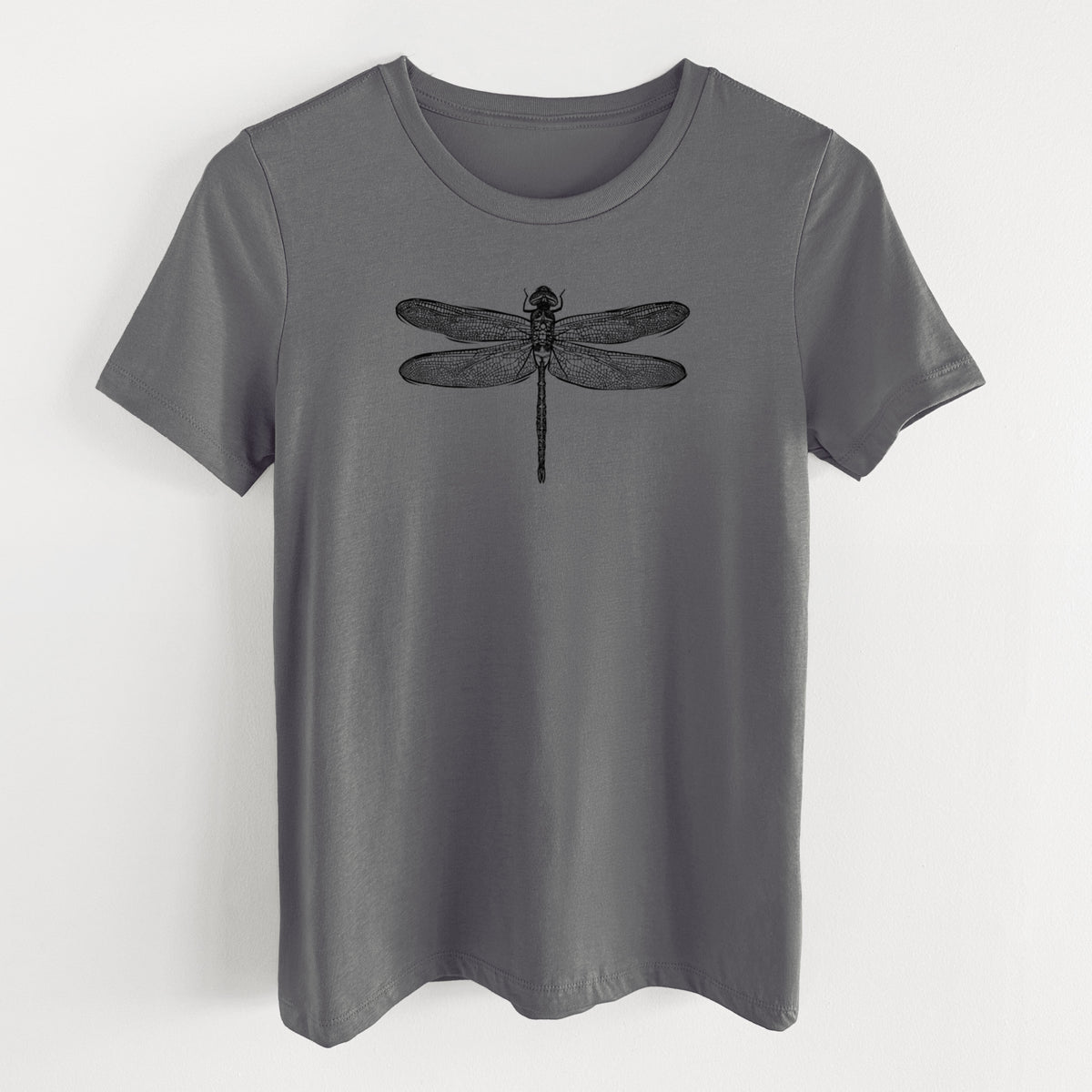 Asphalt women's relaxed fit cotton t-shirt laid flat, printed with a detailed black ink illustration of a green darner dragonfly with its wings spread, seen from above.
