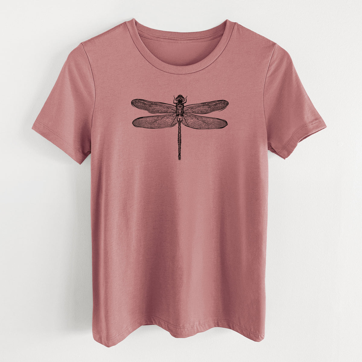 Mauve pink women's relaxed fit cotton t-shirt laid flat, printed with a detailed black ink illustration of a green darner dragonfly with its wings spread, seen from above.