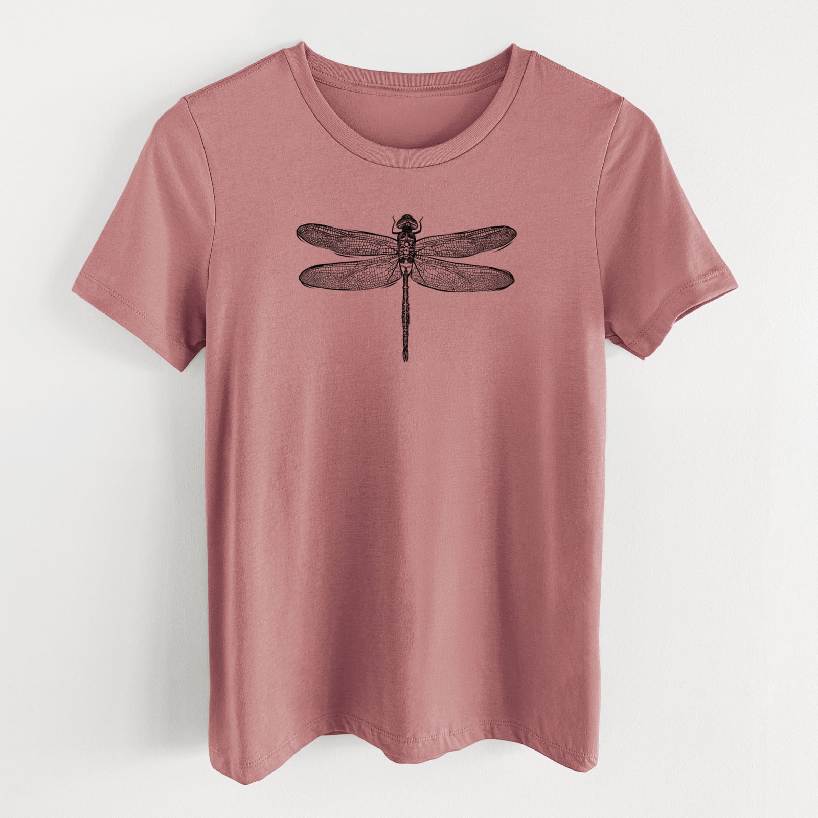 Mauve pink women's relaxed fit cotton t-shirt laid flat, printed with a detailed black ink illustration of a green darner dragonfly with its wings spread, seen from above.