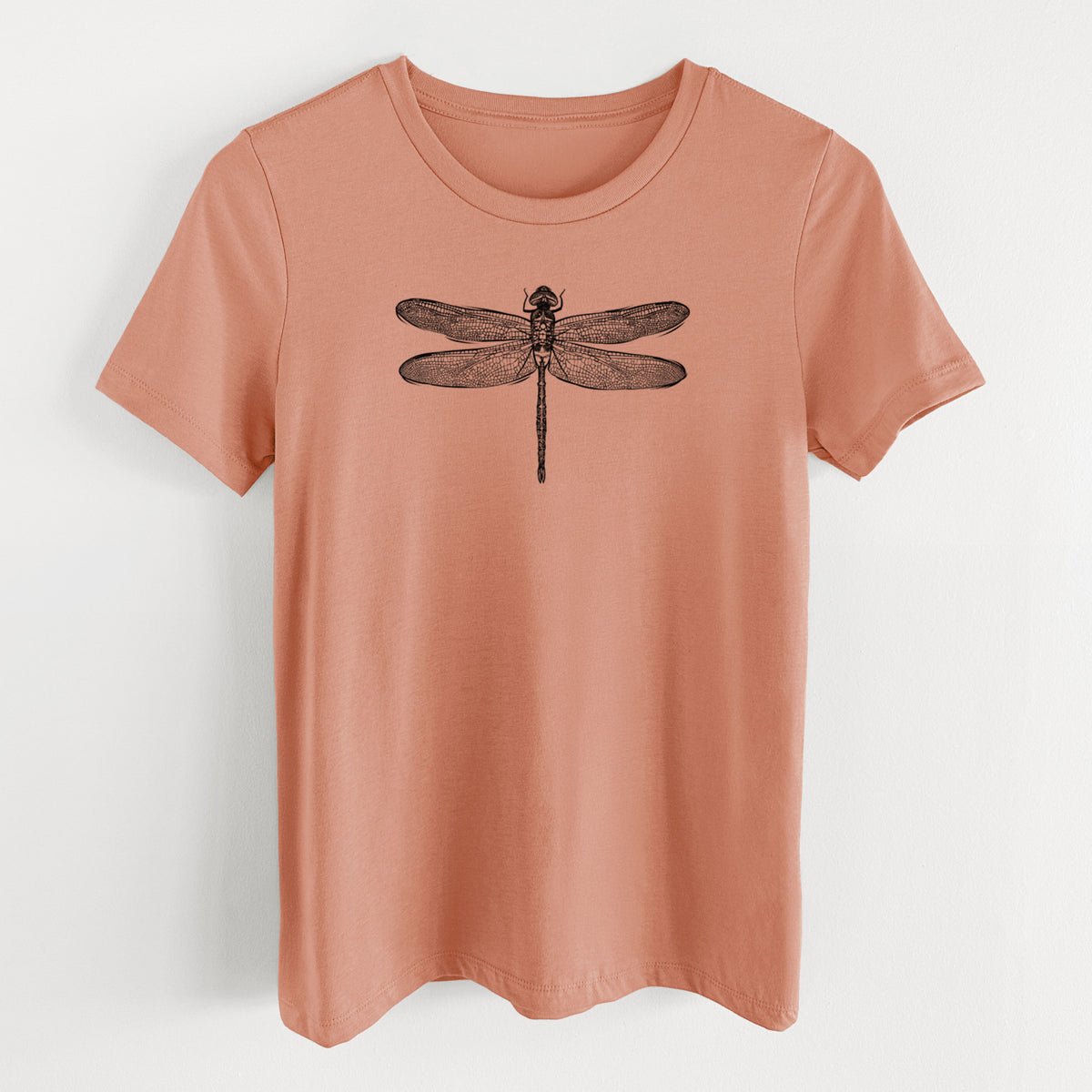 Terracotta orange women's relaxed fit cotton t-shirt laid flat, printed with a detailed black ink illustration of a green darner dragonfly with its wings spread, seen from above.