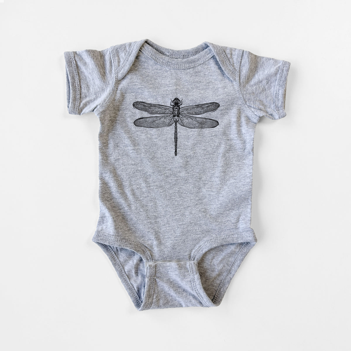 Grey baby bodysuit laid flat, printed with a detailed black ink illustration of a green darner dragonfly with its wings spread, seen from above.