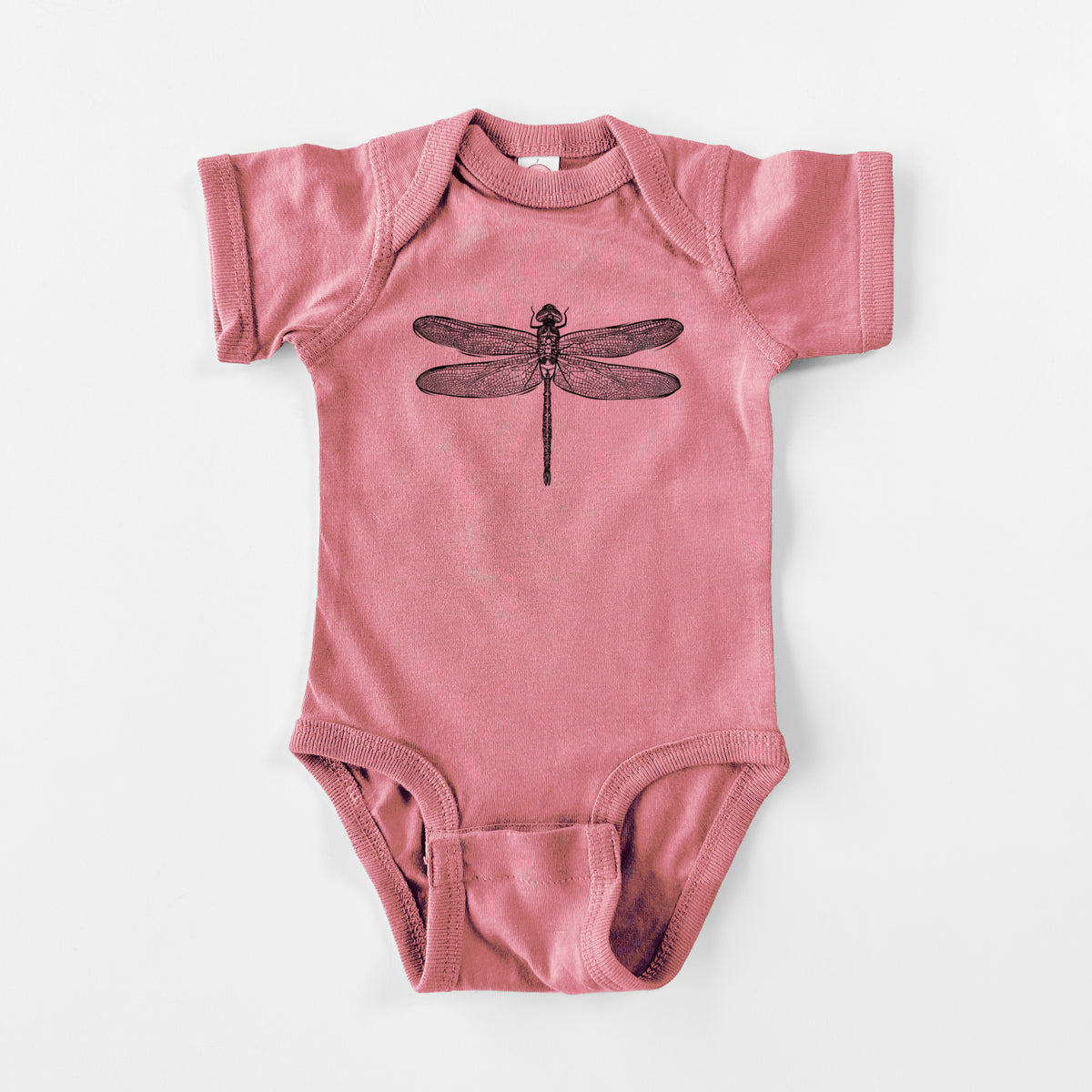 Mauve pink baby bodysuit laid flat, printed with a detailed black ink illustration of a green darner dragonfly with its wings spread, seen from above.