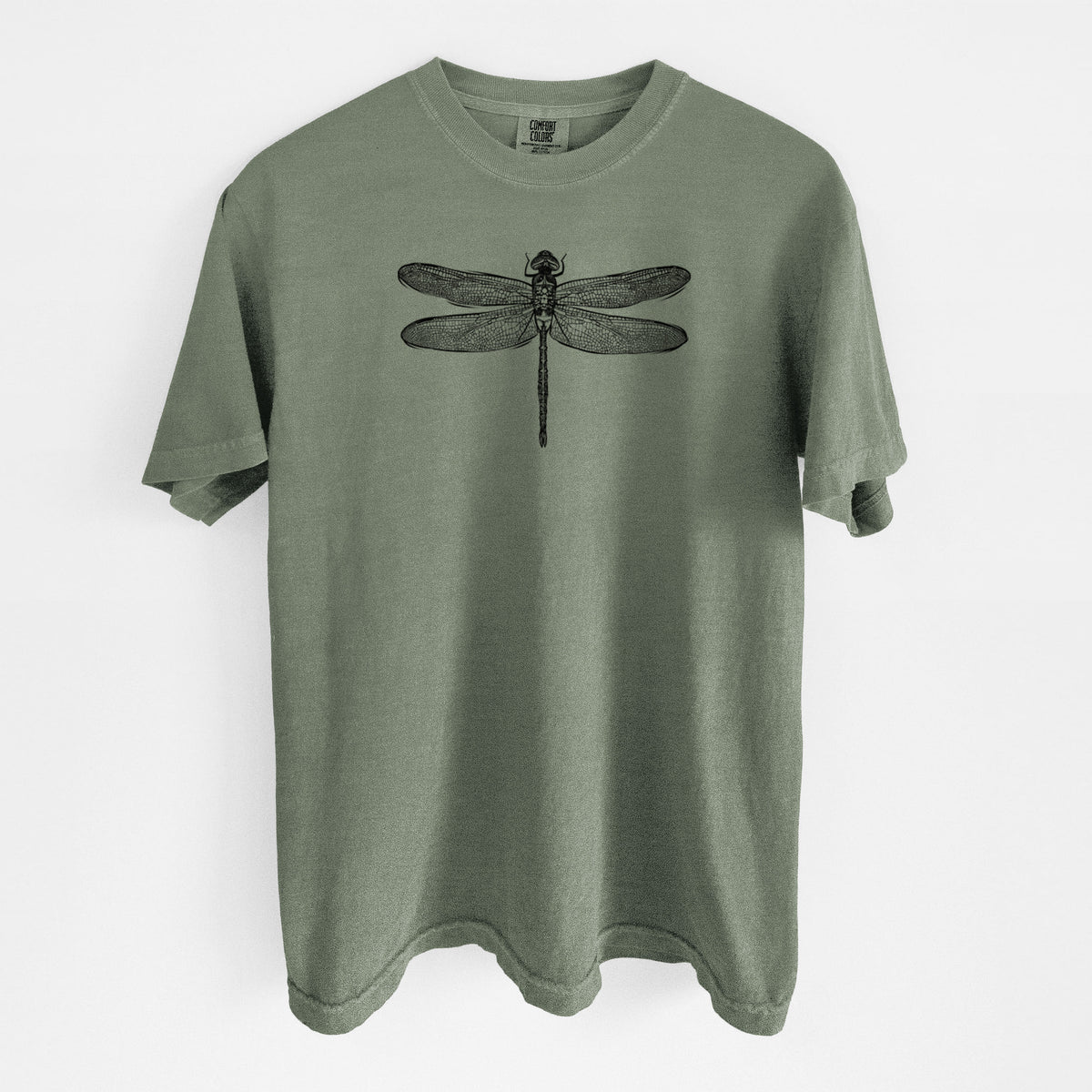 Moss green Comfort Colors t-shirt laid flat, printed with a detailed black ink illustration of a green darner dragonfly with its wings spread, seen from above.