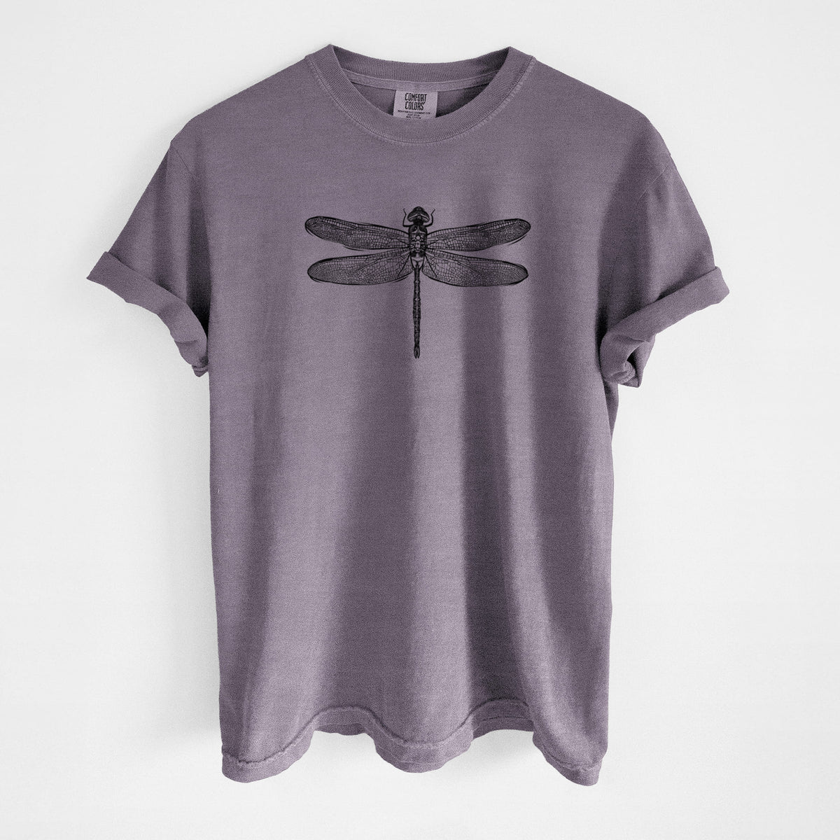 Wine red Comfort Colors t-shirt laid flat, printed with a detailed black ink illustration of a green darner dragonfly with its wings spread, seen from above.