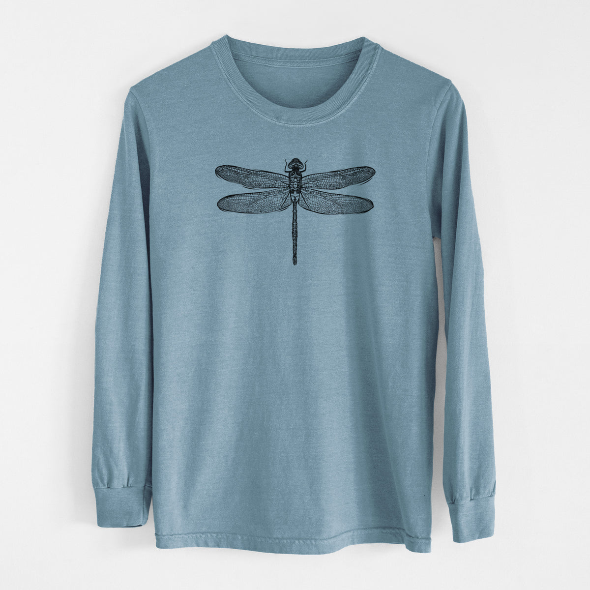 Steel blue Comfort Colors long sleeve shirt laid flat, printed with a detailed black ink illustration of a green darner dragonfly with its wings spread, seen from above.