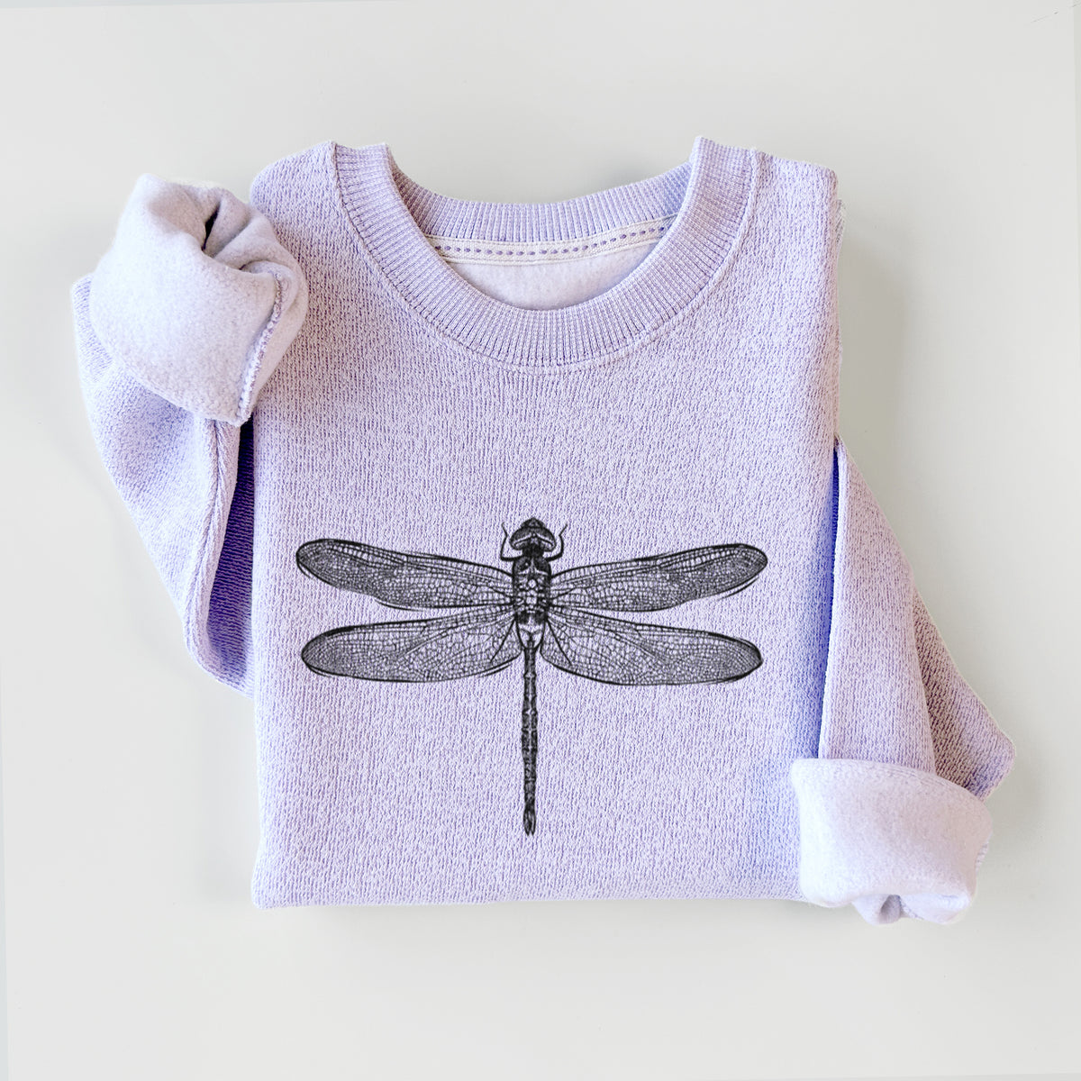 Ice purple knit sweatshirt printed with a detailed black ink illustration of a green darner dragonfly with its wings spread, seen from above, styled flat.