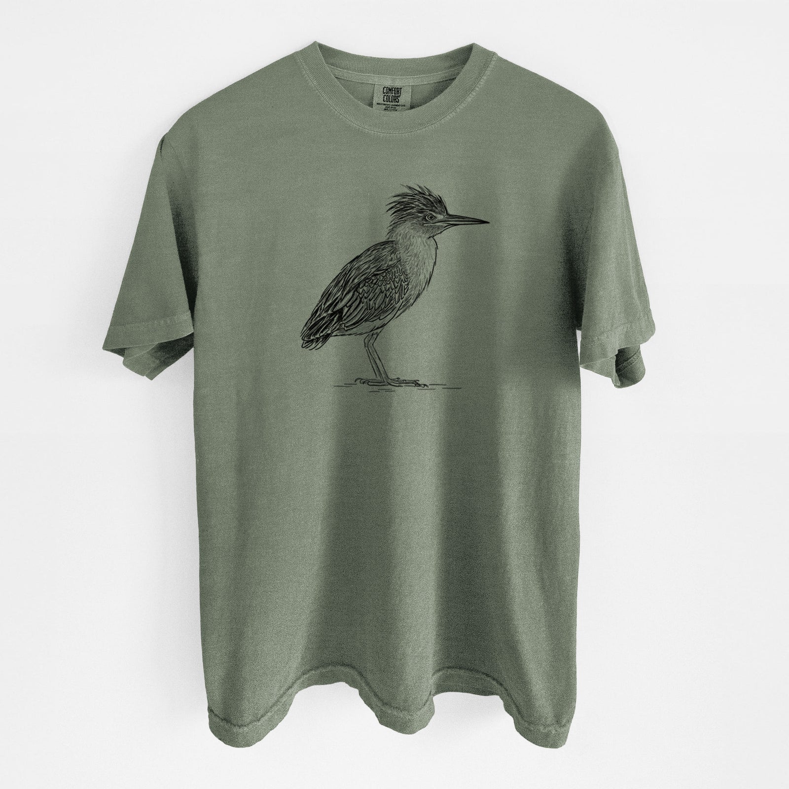Moss green Comfort Colors t-shirt laid flat, printed with a detailed black ink illustration of a green heron standing with its crest raised.