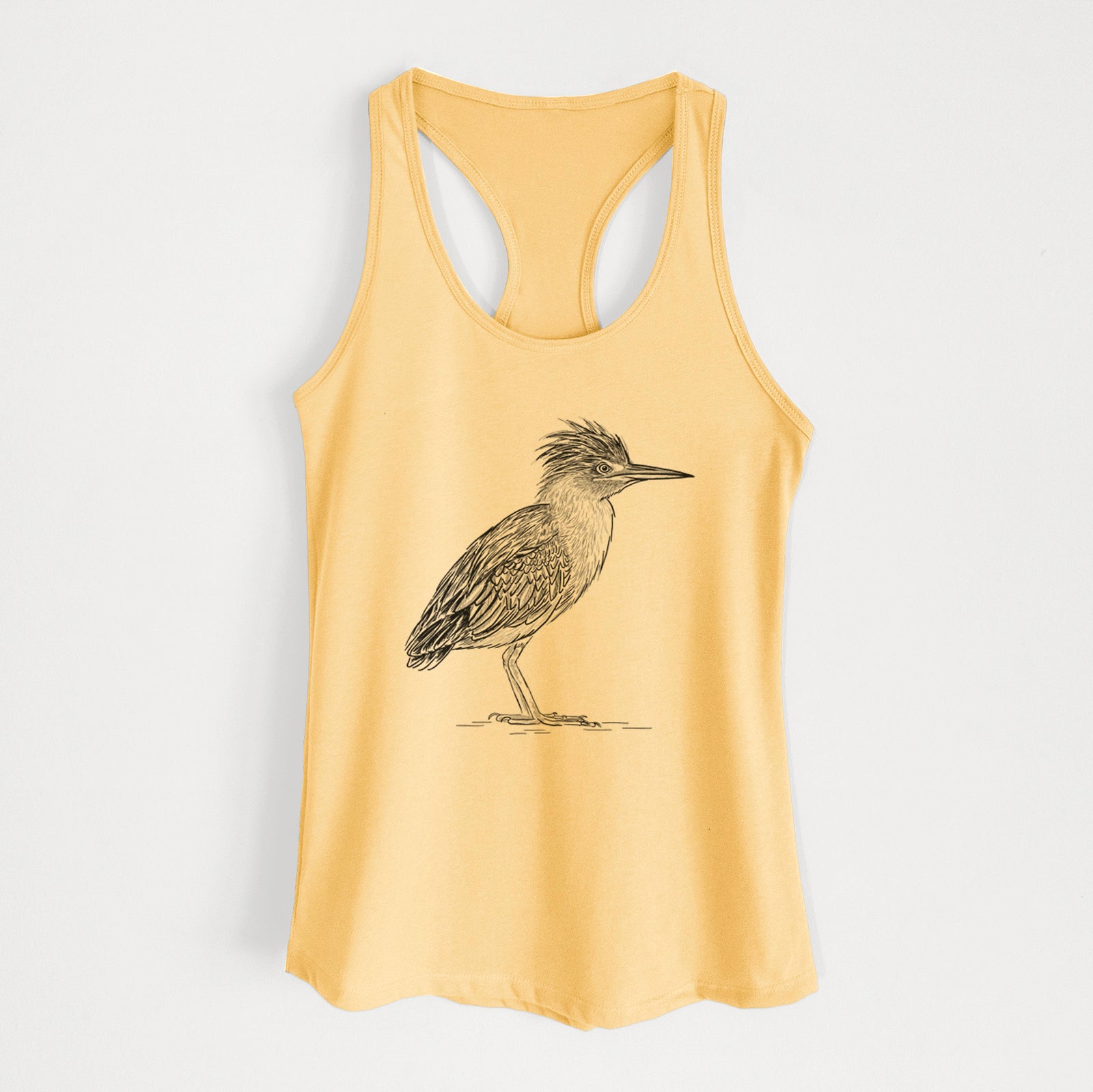 Banana cream women's racerback tank top laid flat, printed with a detailed black ink illustration of a green heron standing with its crest raised.