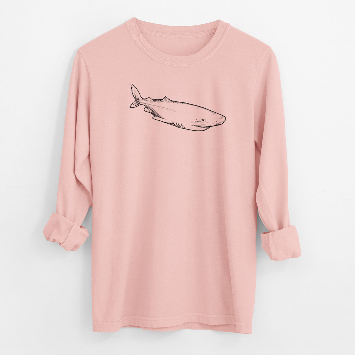 Peachy Comfort Colors long sleeve shirt laid flat with the cuffs rolled, printed with a black ink illustration of a Greenland shark swimming.